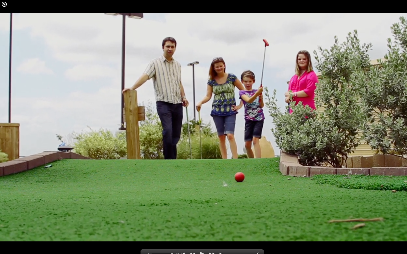 Family Playing Miniature Golf at Cinergy Cinemas